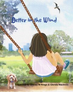 Better in the Wind Cover, Kate is swinging on a tree swing